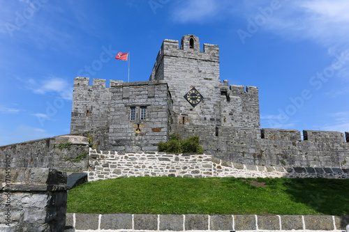 Castle Rushen in Castletown in the Isle of Man, with the red three legs flag of the Island