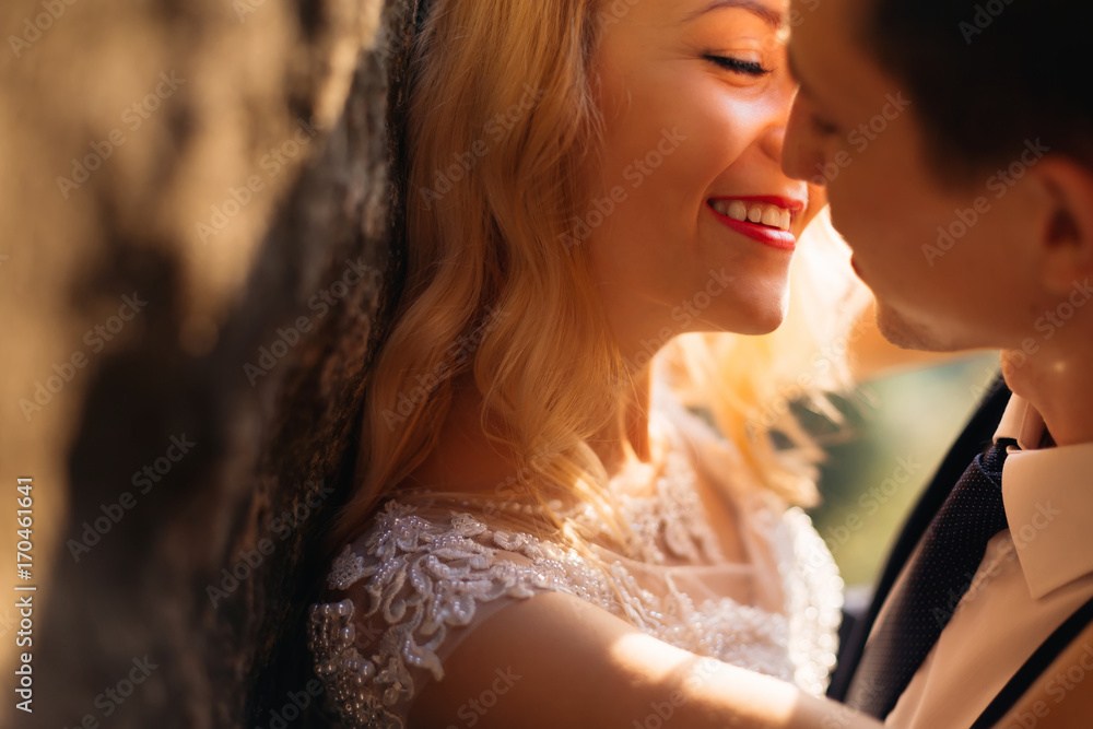 Cheerful happy couple in love kissing tenderly close up Cheerful happy couple in love kissing tenderly close up