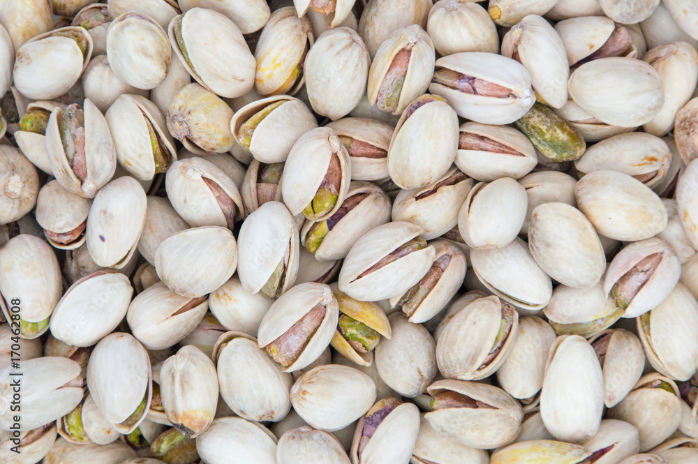 Salty pistachios as background.