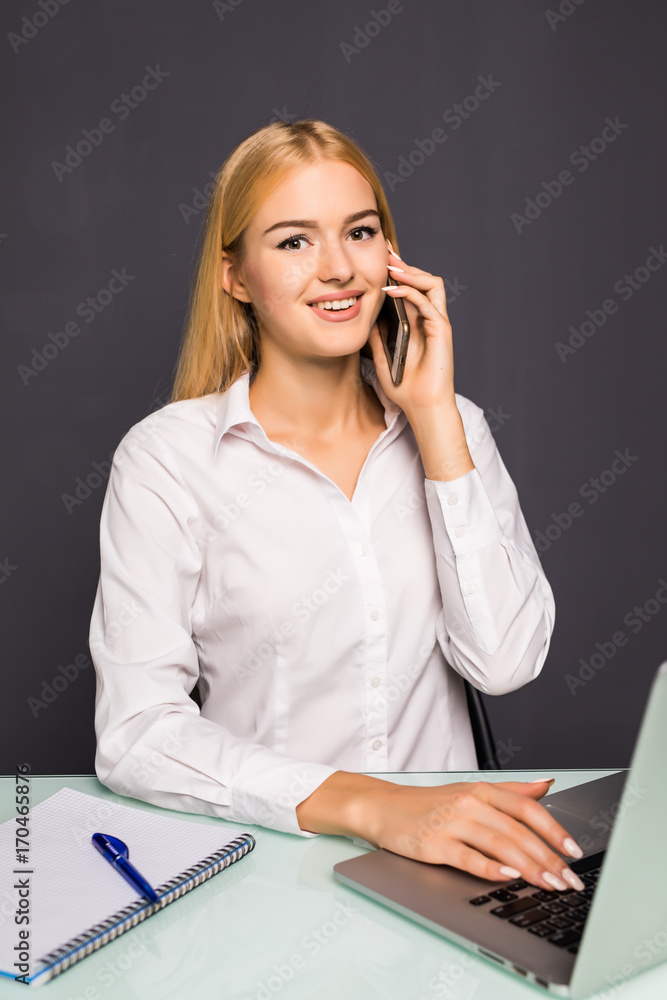 joyful smiling young woman having talk by phone in office joyful smiling young woman having talk by phone in office