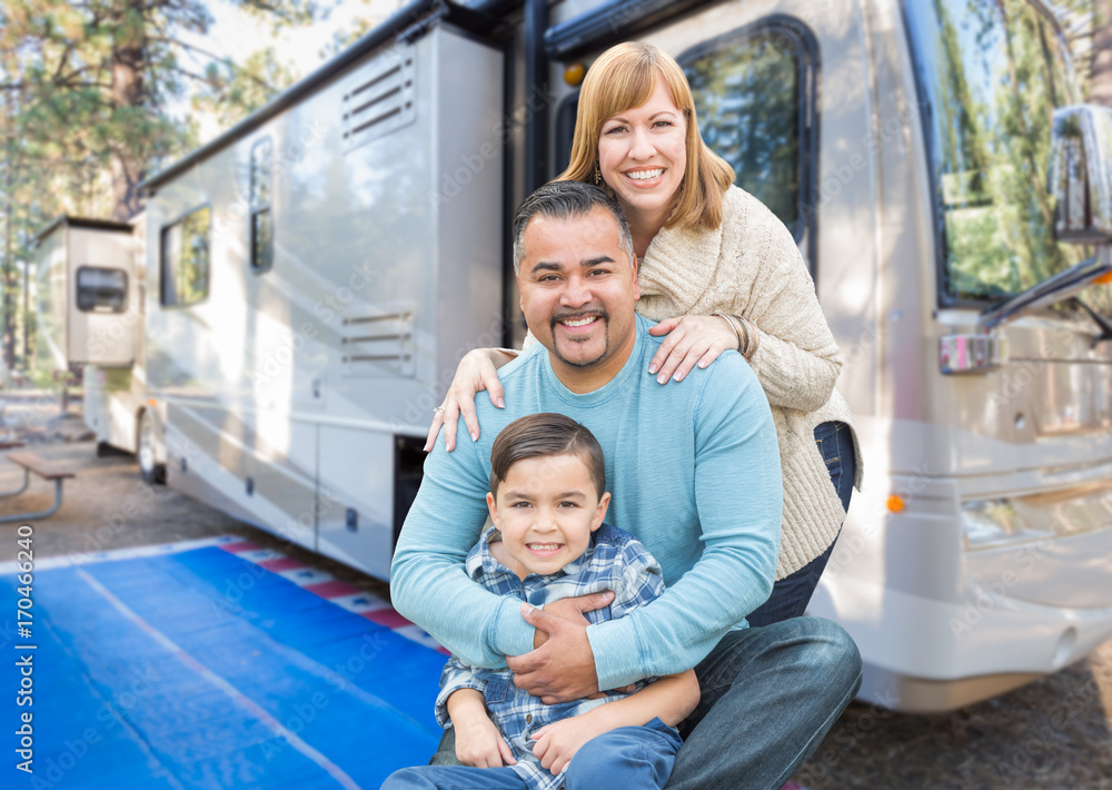 Obraz premium Happy Young Mixed Race Family In Front of Their Beautiful RV At The Campground.