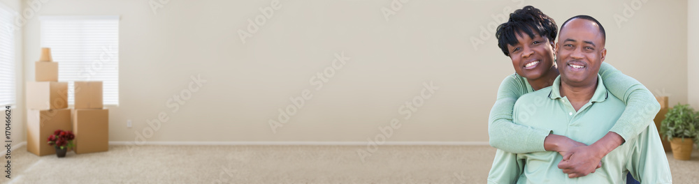 Banner of Happy African American Couple Inside Empty Room with Moving Boxes. Banner of Happy African American Couple Inside Empty Room with Moving Boxes.