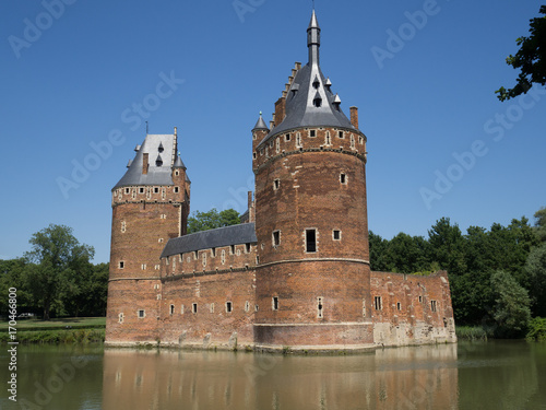 A medieval castle surrounded by water in Beersel, Belgium. photo