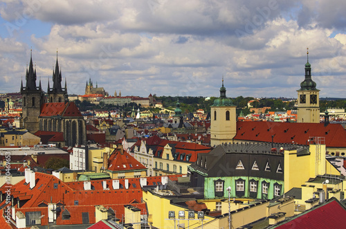 Amazing view of the center of Prague from the Powder Tower. In the foreground there are towers of Church of Our Lady before Tyn. On the horizon is visible Prague Castle with St. Vitus Cathedral