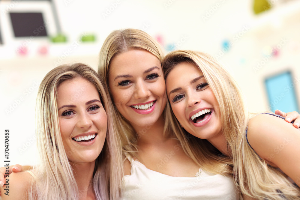Fototapeta premium Three beautiful young women chilling at home