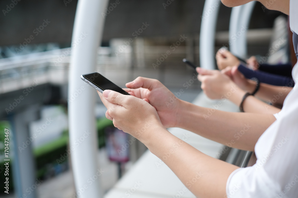 close up people using cellular mobile device for working and relax concept for innovation technology