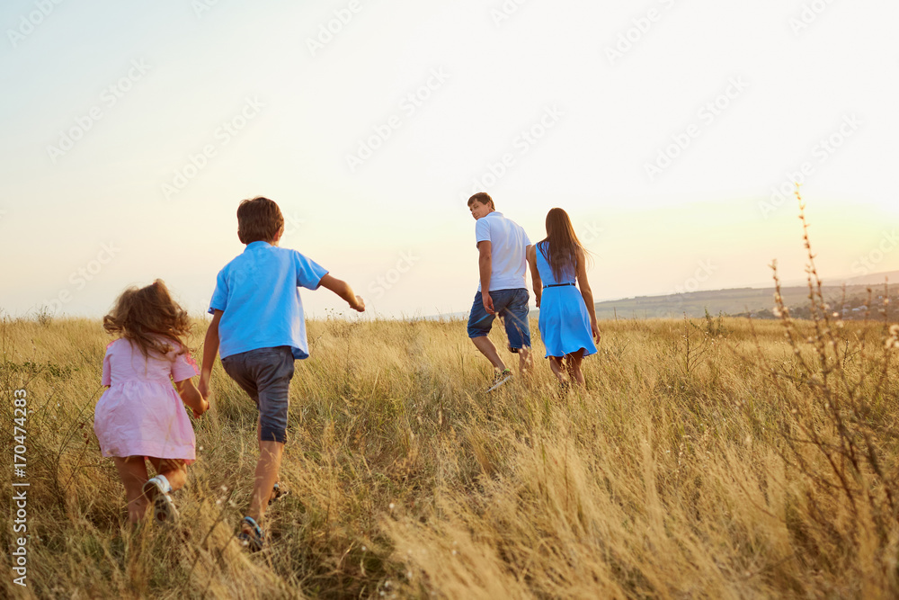 Happy family playing on nature in autumn summer. Happy family playing on nature in autumn summer.