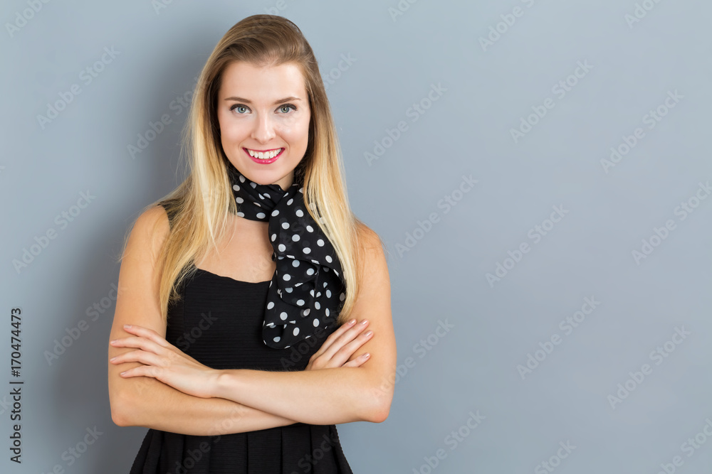 Happy young woman on a gray background Happy young woman on a gray background