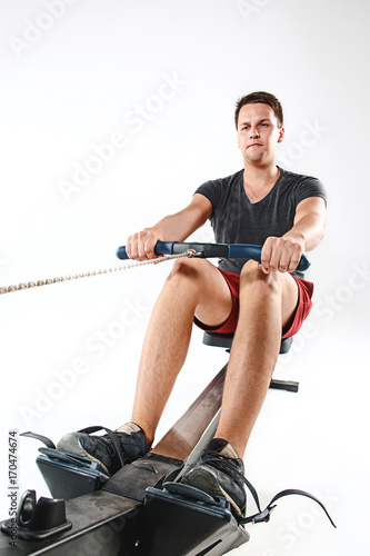 Man Using A Press Machine In A Fitness Club.