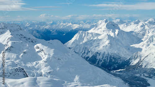 Winter mountain valley sunny panoramic view from Corvatsch peak of the Lower Engadine, in the Switzerland. © thecolorpixels