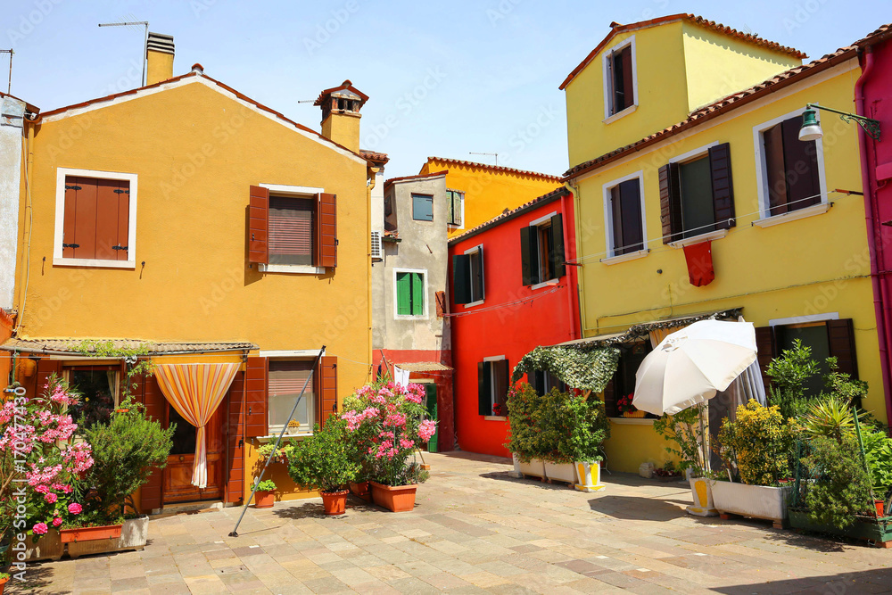 Small, cozy courtyard with colorful cottage /  Burano, Venice/ The small yard with bright walls of houses