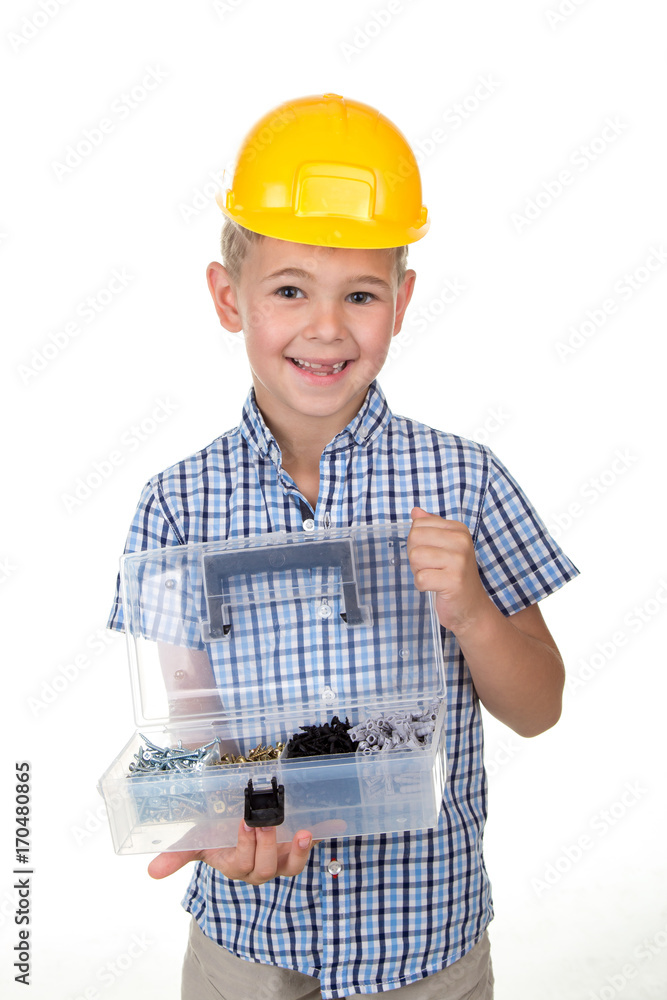 Studio picture of handsome smiling boy in a blue checkered shirt and yellow helmet, holding opened toolbox, on white Studio picture of handsome smiling boy in a blue checkered shirt and yellow helmet, holding opened toolbox, on white
