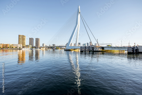 Landscape view on the beautiful riverside with skyscrapers and bridge during the morning in Rotterdam city