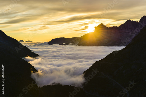 sunset on a sea of clouds in the swiss alps