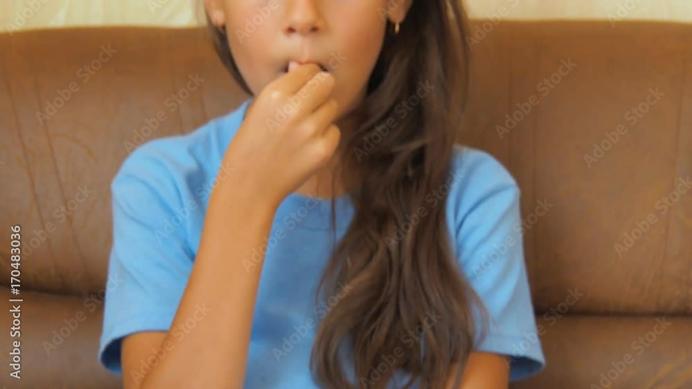 The child drinks medicines. A little girl drinks a pill. The child drinks medicines. A little girl drinks a pill.