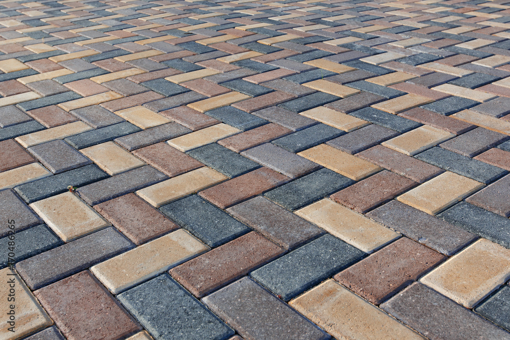 Fototapeta premium Colorful cobblestone road pavement
