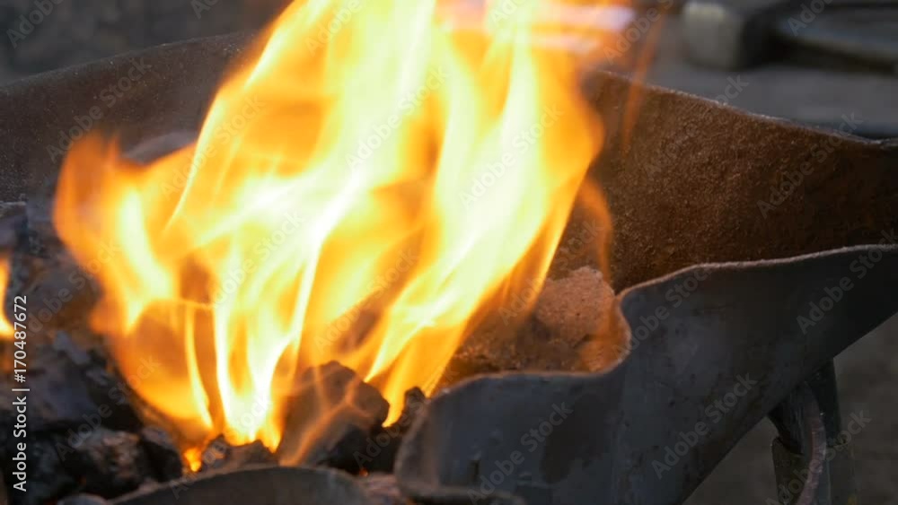 Burning coal in the hearth of a blacksmith Burning coal in the hearth of a blacksmith