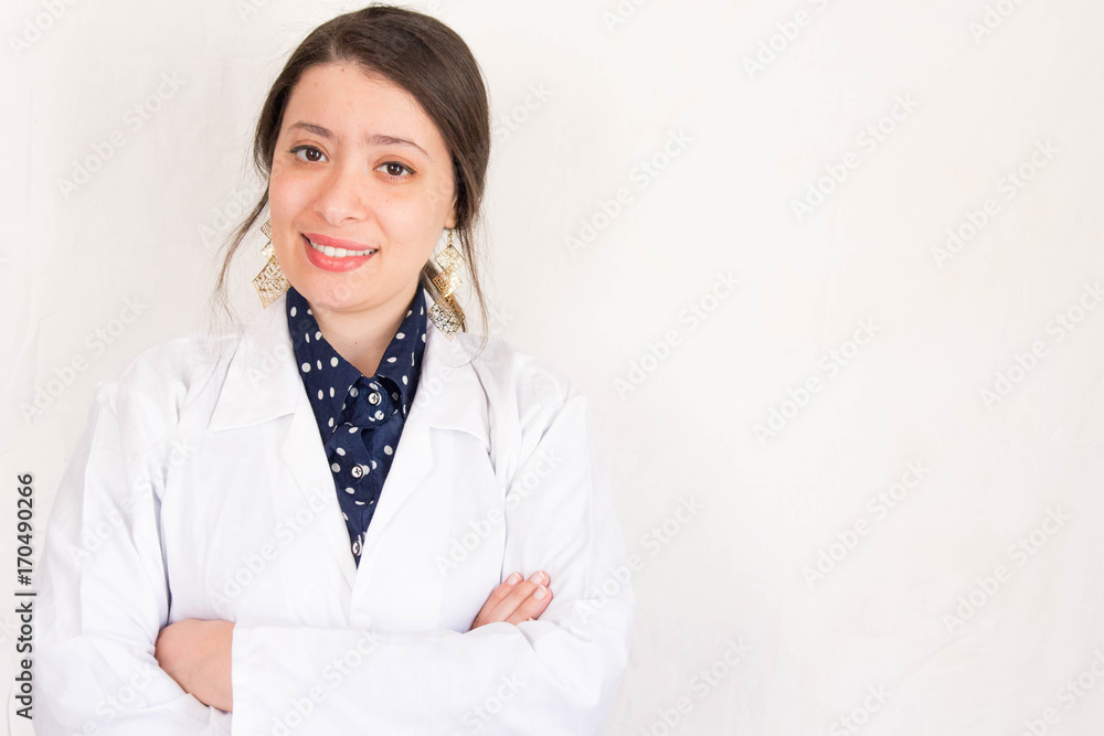 Cheerful happy muslim arabic doctor woman with crossed hands Cheerful happy muslim arabic doctor woman with crossed hands
