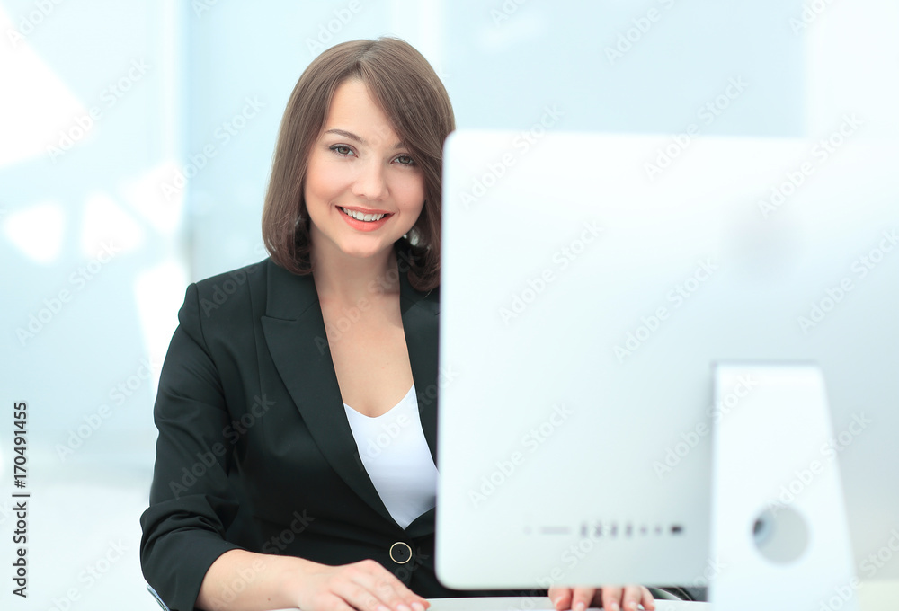 Business woman working with computer in an office Business woman working with computer in an office