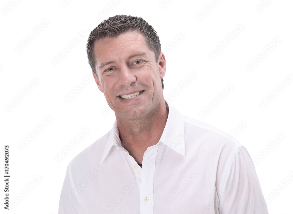 Happy mature man in shirt smiling while standing against white Happy mature man in shirt smiling while standing against white