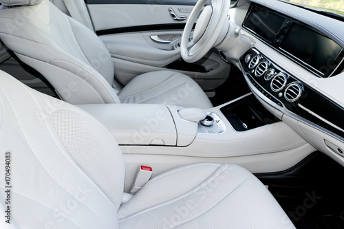 Wallpaper Mural White leather interior of the luxury modern car. Leather comfortable white seats and multimedia. Steering wheel and dashboard. Automatic gear stick. Modern car interior details Torontodigital.ca