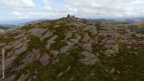 Tourists are resting on the top of the Dalsnuten mountain in Norway, aerial view photo