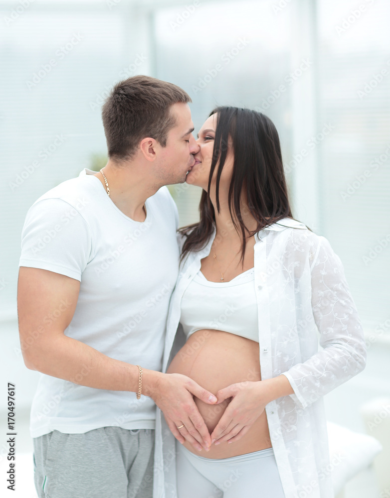 beautiful pregnant woman and her handsome husband beautiful pregnant woman and her handsome husband