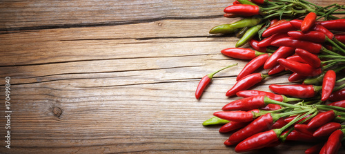 Fotografia Red chili pepper on wooden background