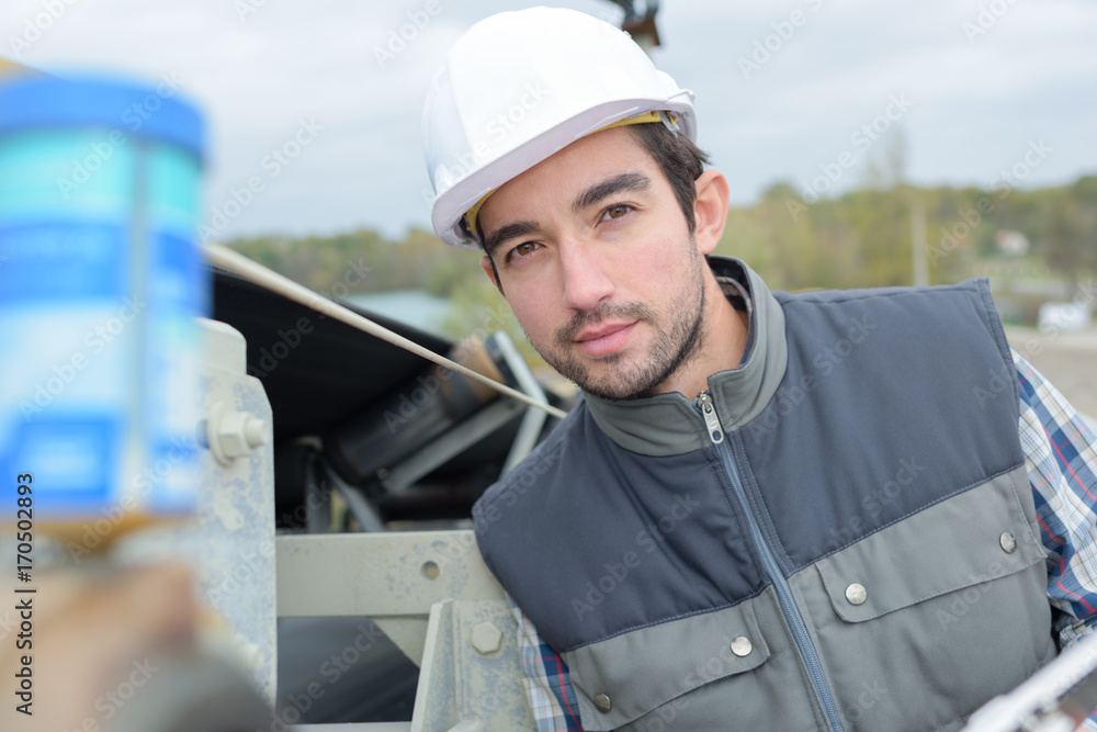 portrait of handsome young construction worker on building site portrait of handsome young construction worker on building site