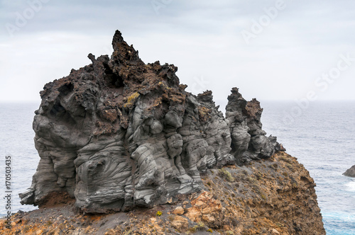 Scenic wild view of volcanic rock coast and natural pools of thr northern Tenerife, Canary Islands, Spain