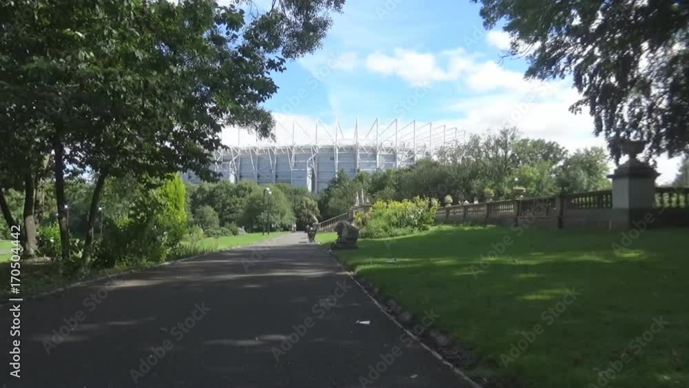 Park shadow stadium 9s- the shadow of the tree in the park and a view on St James stadium in Newcastle upon Tyne Park shadow stadium 9s- the shadow of the tree in the park and a view on St James stadium in Newcastle upon Tyne