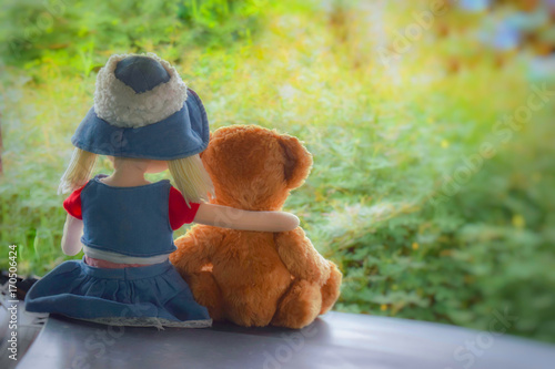 girl doll and teddy bear friend
