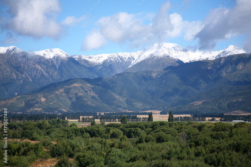 View of the Southern Alps near Hanmer Springs, New Zealand, in summer looking across the North Canterbury Plains View of the Southern Alps near Hanmer Springs, New Zealand, in summer looking across the North Canterbury Plains