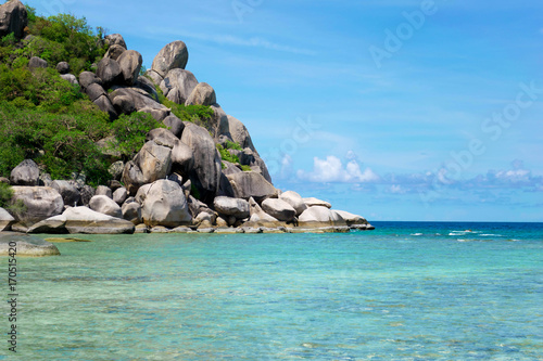 The stone on the beach with blue sea at Koh Chang island in Thailand