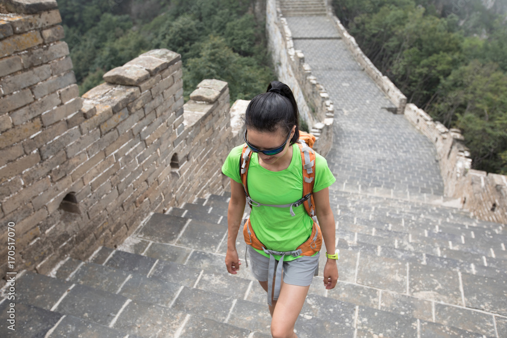 young woman hiker hiking on great wall young woman hiker hiking on great wall