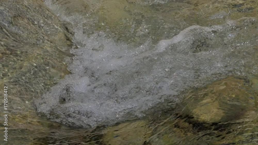 Water in a mountain river in slow motion video. Water in a mountain river in slow motion video.