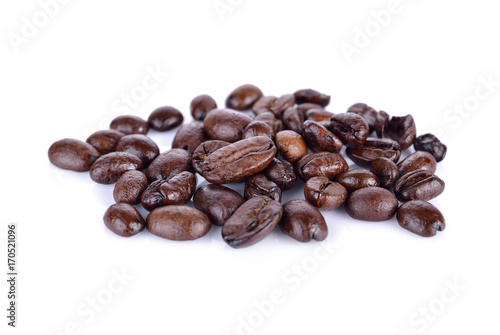 pile of roasted coffee beans arabica strong blend on white background