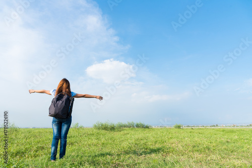 Traveler hiking photographer woman has happy and relax on vacation with blue sky in the morning.