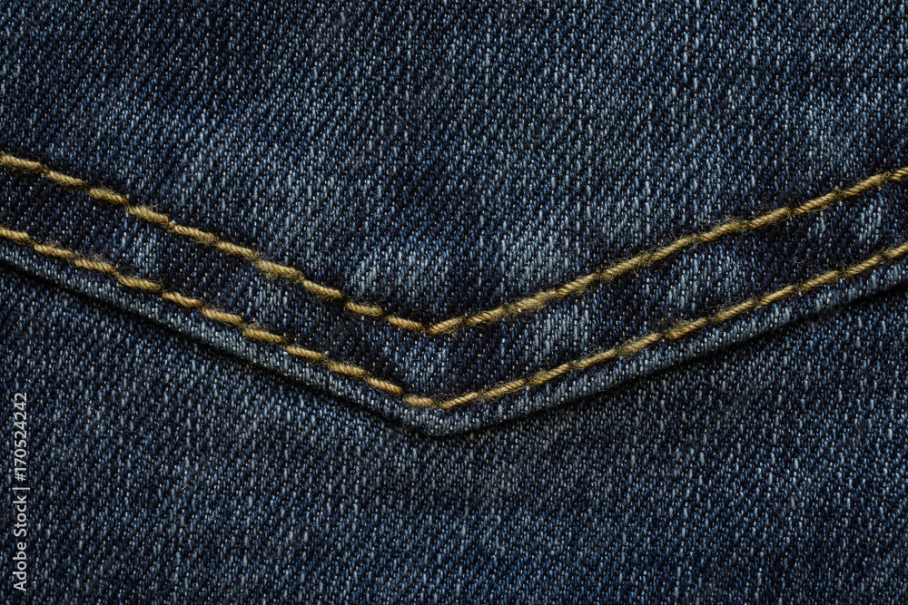 detail of seam on the back pocket of the denim trousers detail of seam on the back pocket of the denim trousers