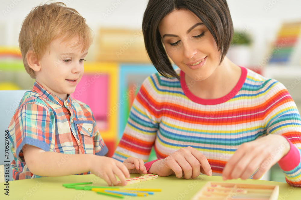 Young mother playing with son