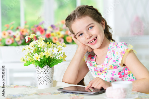 Little girl using tablet