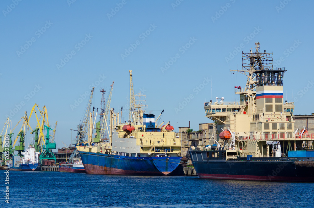 hoisting cranes and ships at seaport