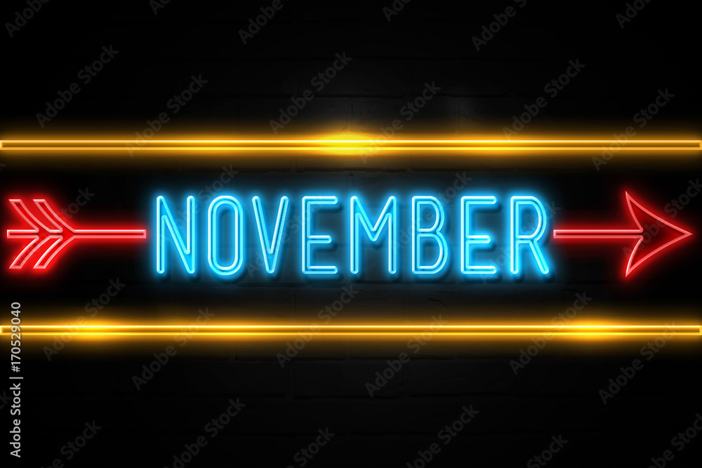 November - fluorescent Neon Sign on brickwall Front view November - fluorescent Neon Sign on brickwall Front view