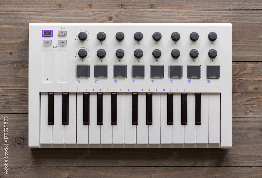 MIDI keyboard with pads and faders.