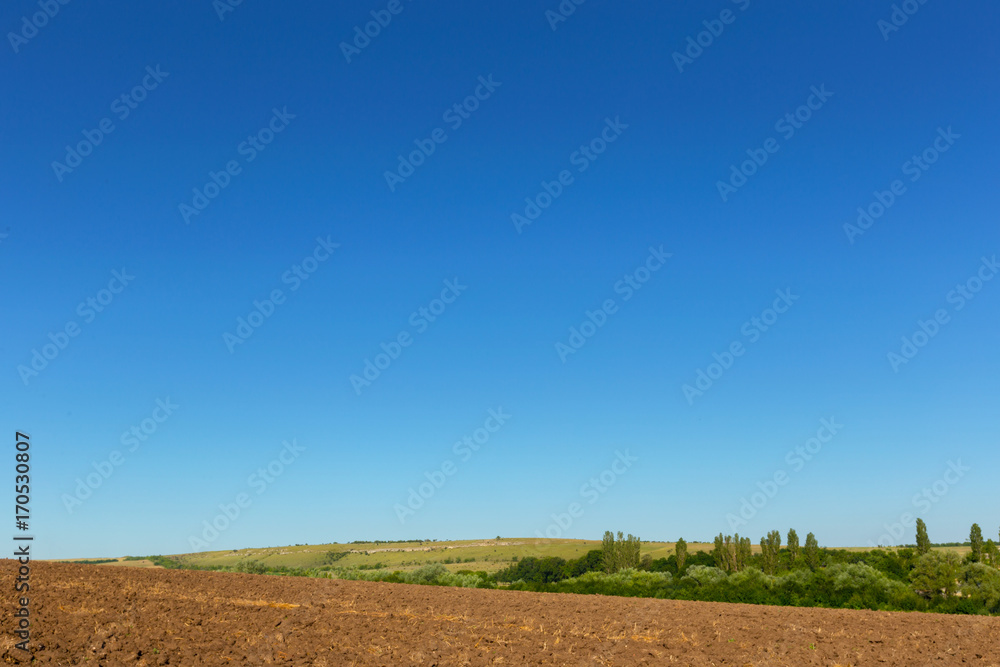Earth in a field for agricultural cultivations Earth in a field for agricultural cultivations