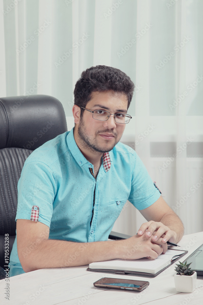 Guy with a notebook and pen