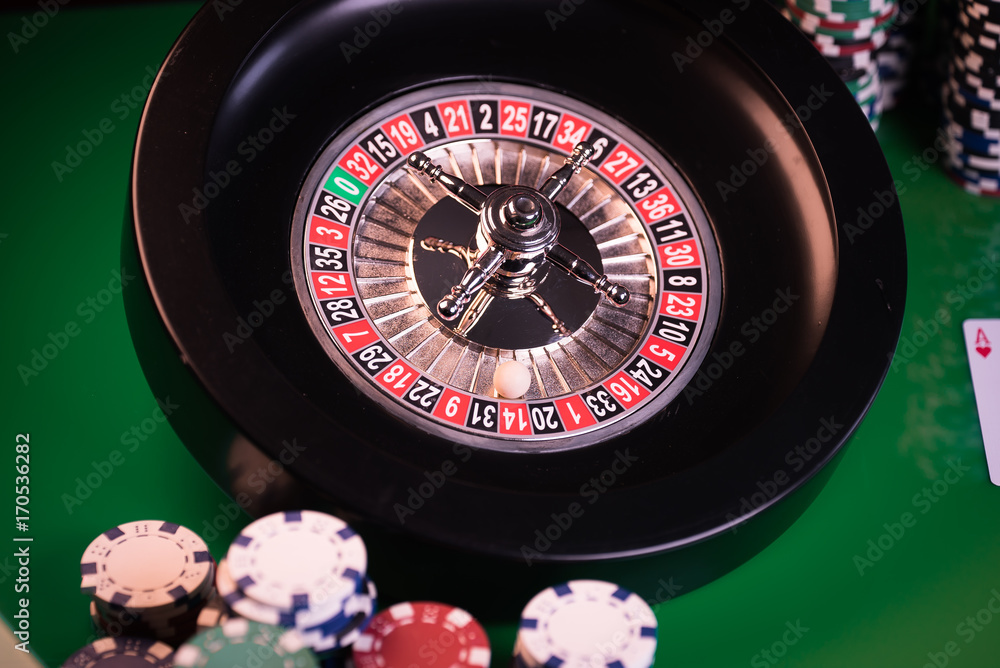 Roulette in casino and Poker Chips Roulette in casino and Poker Chips