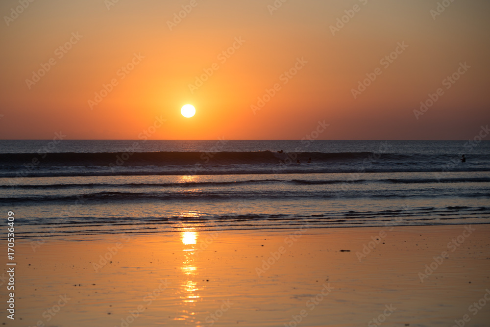 Sunset on the tropical beach. Cuta beach on Bali island. Indonesia Sunset on the tropical beach. Cuta beach on Bali island. Indonesia