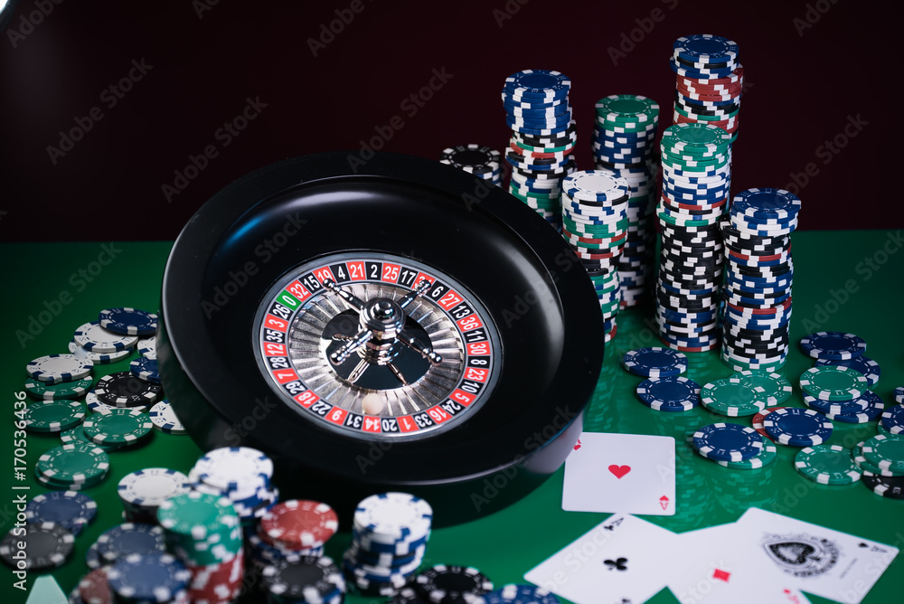 Roulette in casino and Poker Chips Roulette in casino and Poker Chips