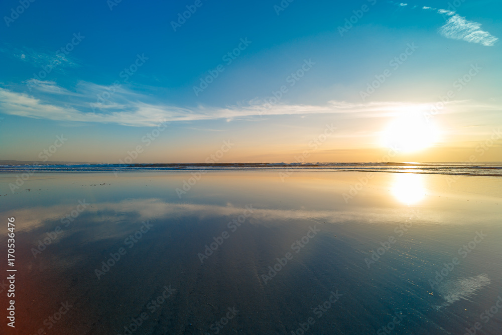 Fototapeta premium Sunset at Cuta Beach, Bali with beautiful mirror reflection